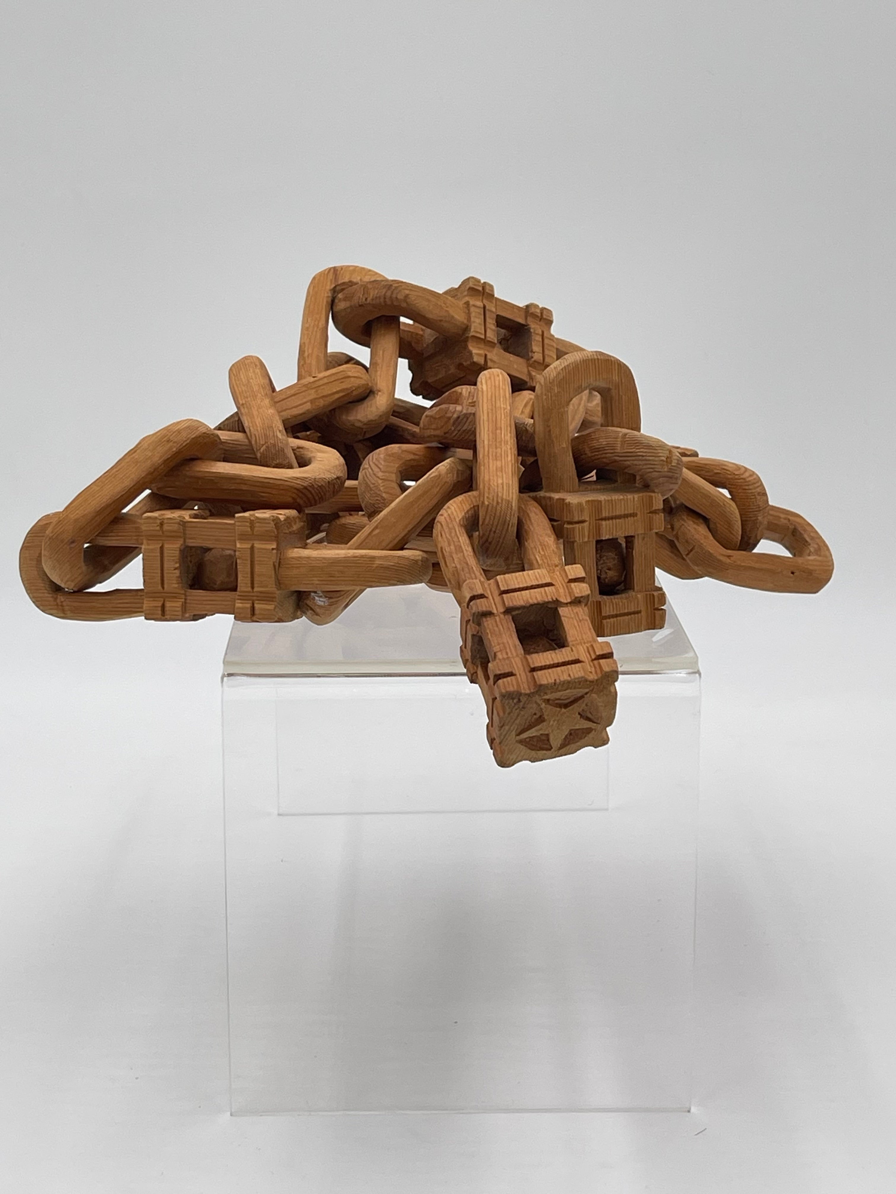 Folk art wood chain carved continuously